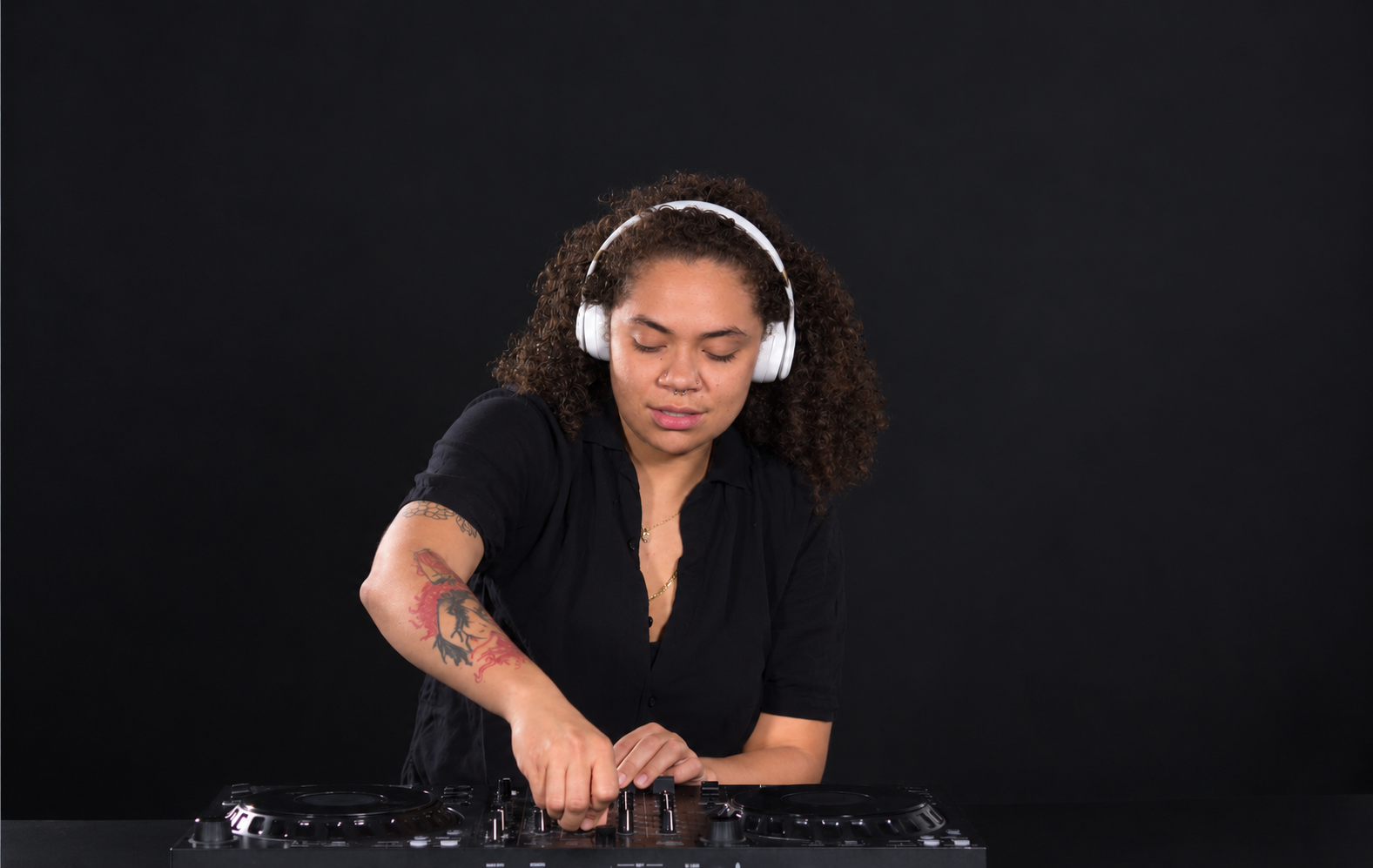 DJ Xhlo mixing in the studio, ButterflyZ Collective photoshoot