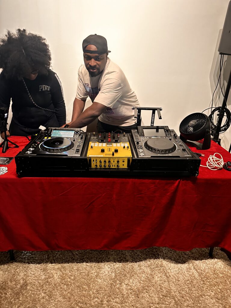 DJ O behind Pioneer CDJ-2000s and a DJM-S9 mixer at ButterflyZ Tech Day in Atlanta
